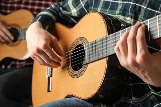 Two guitar players with classic guitars, space for text