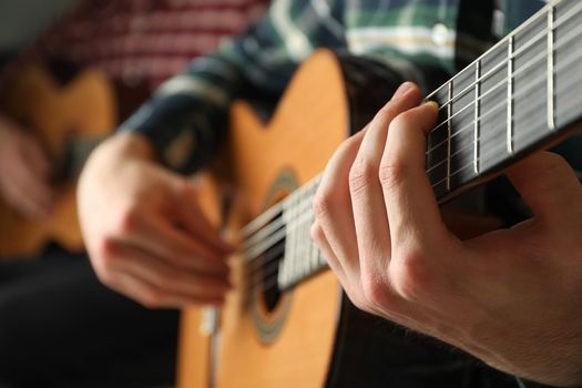 Two guitar players with classic guitars, space for text