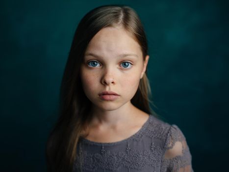 beautiful girl loose hair dark background cropped view close-up. High quality photo