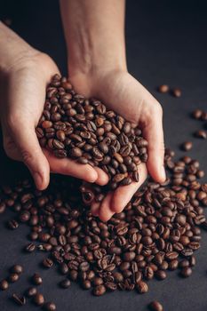 coffee beans in hands aroma morning vigor drink. High quality photo