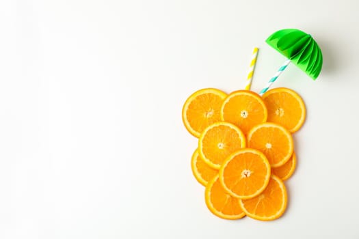 Composition with orange pieces and tubules on white background, top view and space for text. Citrus fruits