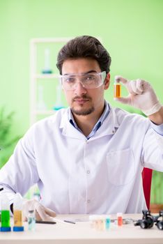 Man chemist working in the lab