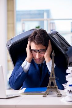 Employee thinking of vacation due to excessive workload