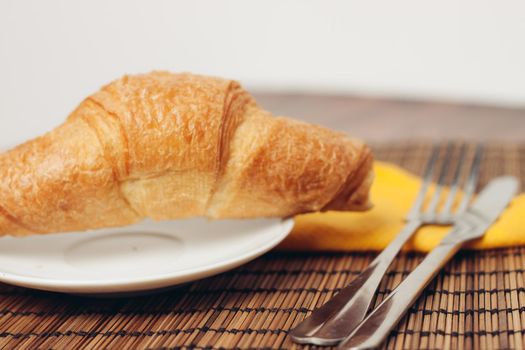 fresh croissants on the table breakfast food ration morning. High quality photo