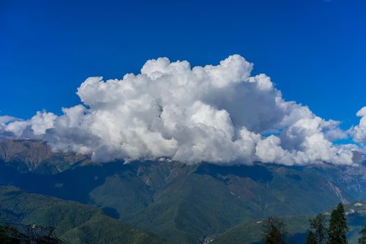 Mountain landscape against cloudy blue sky in Krasnaya Polyana Sochi.