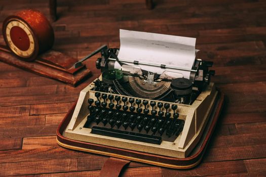 typewriter retro style nostalgia journalist technology technology wood background. High quality photo