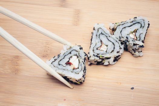 sushi chopsticks restaurant wood cutting board asian food. High quality photo