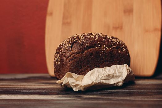 rye bread on a paper stand and a blackboard in the background. High quality photo