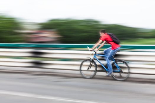 Abstract motion blur image of active people on bicycle in the city roadway