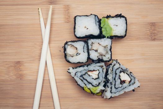 japanese cuisine sushi rolls traditional food chopsticks. High quality photo