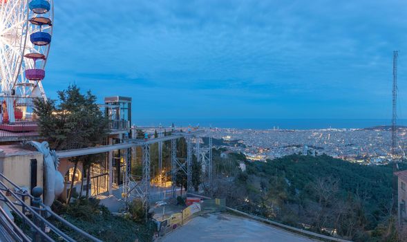 Barceloan, Spain : 2021 February 11 : Wheel of minions over the city, in Tibidabo, Barcelona in 2021.