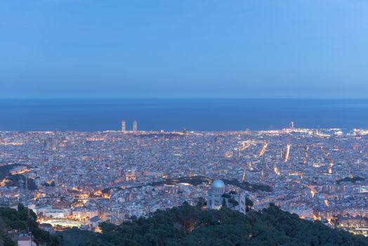 Sunset in the Tividabo view point in Barcelna, Spain. over the city, in Tibidabo, Barcelona.