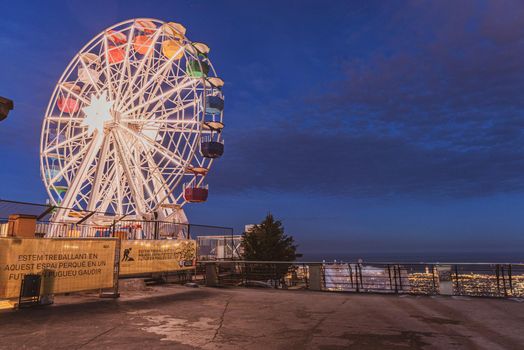 Wheel of minions over the city, in Tibidabo, Barcelona.