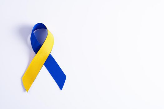 Down syndrome day with blue yellow ribbon awareness support patient with illness disability