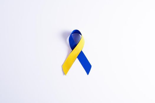 Down syndrome day with blue yellow ribbon awareness support patient with illness disability