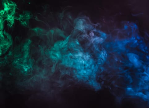 Defocused blurred abstract image of colorful smoke. Texture and abstract art