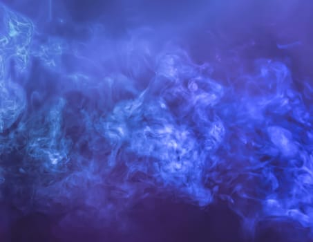 Defocused blurred abstract image of blue smoke. Texture and abstract art
