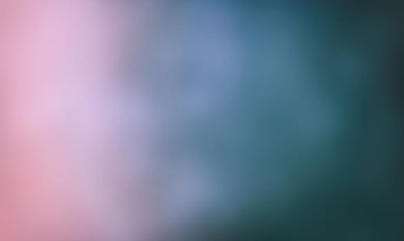 Defocused blurred image of colorful smoke on dark background. Texture and abstract art