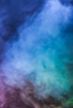 Defocused blurred abstract image of colorful smoke. Texture and abstract art