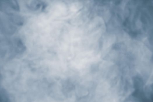 Soft focus abstract image of colorful smoke on dark background. Texture and abstract art
