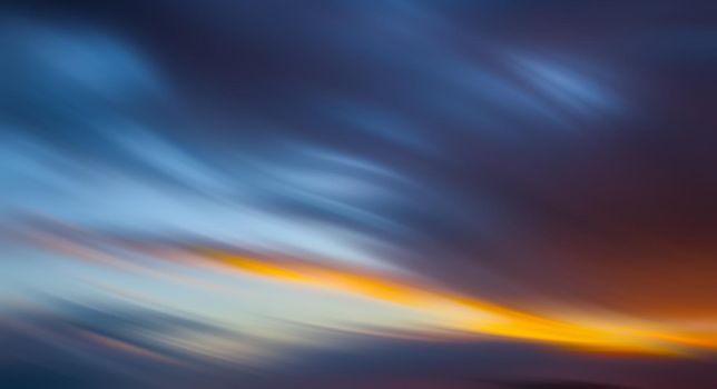 Abstract blurred sunset cloudy sky background