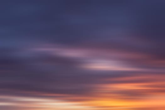 Blurred nature background. Smooth relax landscape. Abstract sunset sky with motion blurred clouds