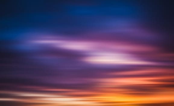 Blurred nature background. Smooth relax landscape. Abstract sunset sky with motion blurred clouds
