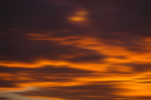 Blurred nature background. Smooth relax landscape. Abstract sunset sky with motion blurred clouds