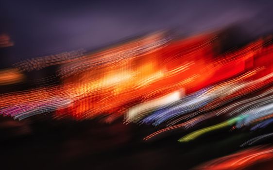 Abstract image of blurred illumination and night lights New York City. Intentional motion blur