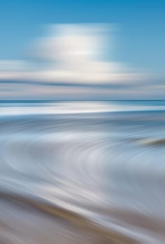 Blurred sea background. Nature background with water and clouds
