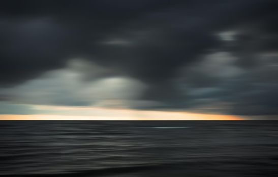 Abstract blurred sea landscape and cloudy sky background