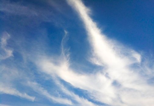 Natural blue sky background with beautiful puffy white clouds.