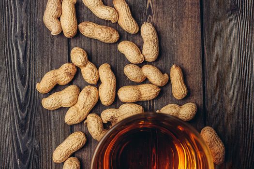 bar wood counter beer mug peanuts snack alcohol. High quality photo