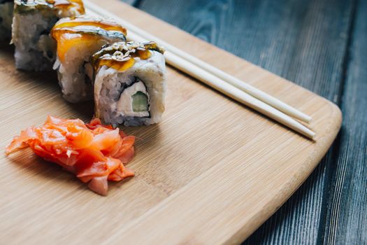 japanese cuisine sushi sauce chopsticks wood board. High quality photo