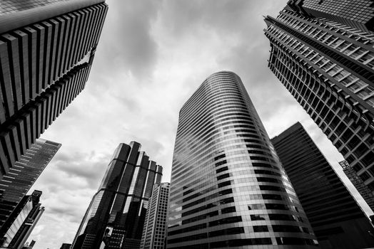 Bottom view of Modern business skyscrapers. Concepts of banking, financial, economics, future. Monochrome black and white color.