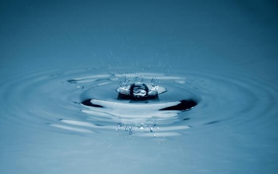 Close-up white water drop falling down.