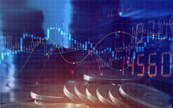 Double exposure of graph and rows of coins for finance and business concept.