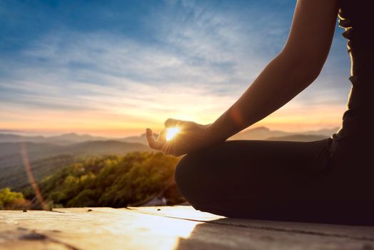 Yoga woman, meditation, yoga poses.close up of female in lotus position meditating in the mountains. happiness living vitality health balance recreation relaxation freedom nature