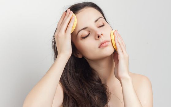 woman with bare shoulders clear skin makeup lifestyle. High quality photo