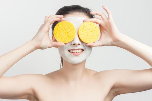 brunette wipes face mask with sponges cropped view. High quality photo