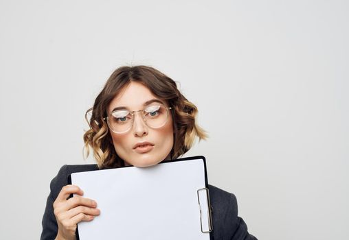 energetic woman with documents in folder classic suit light background mockup. High quality photo