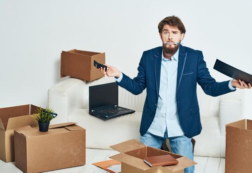 a man near the couch unpacking a new office official. High quality photo