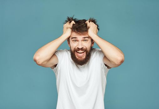 Emotional man gestures with his hands surprise shock model. High quality photo