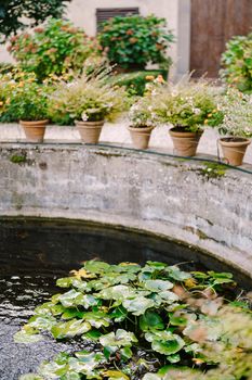 Ancient fountain in the center of the courtyard of a villa-winery in Italy, Tuscany.