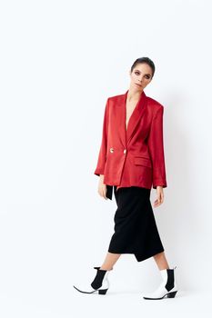 woman in a red jacket bright cosmetics fashionable clothes. High quality photo