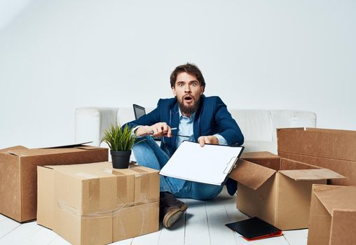 business man documents boxes unpacking professional office. High quality photo