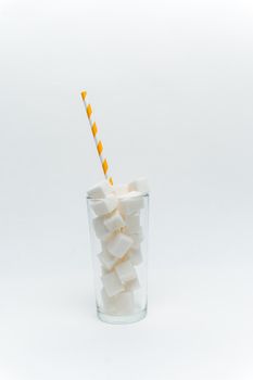 sugar cubes in a glass with a tube high-calorie cocktail. High quality photo