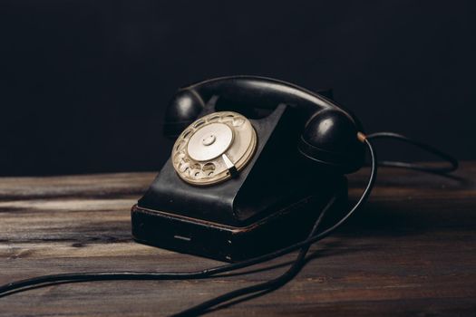 black retro telephone on the table office old technology call antique. High quality photo