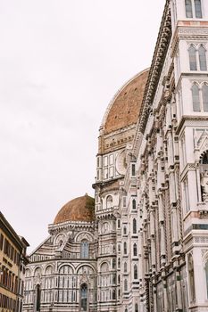 A close-up of the facade of the Santa Maria del Fiore building in Florence, Italy.