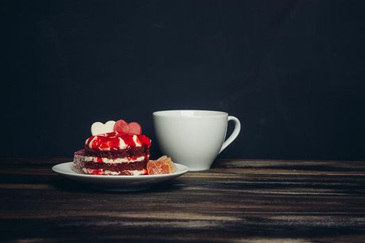 Round red cake on a plate marmalade sweets dessert. High quality photo